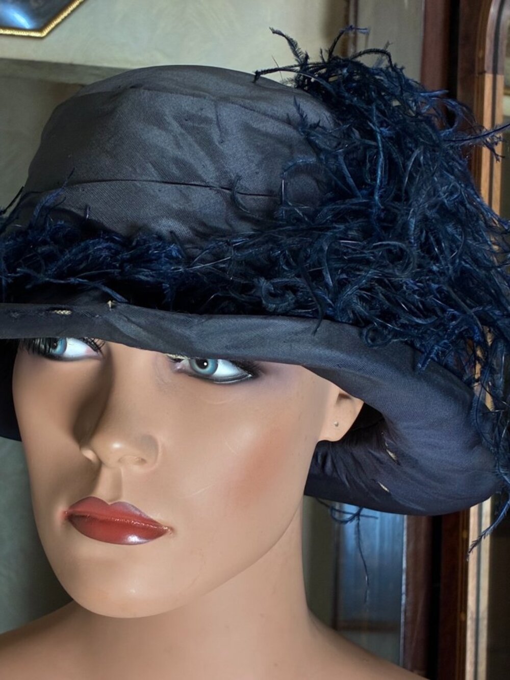 Designer Silk Flapper Cloche hat, adorned with an ostrich feather
